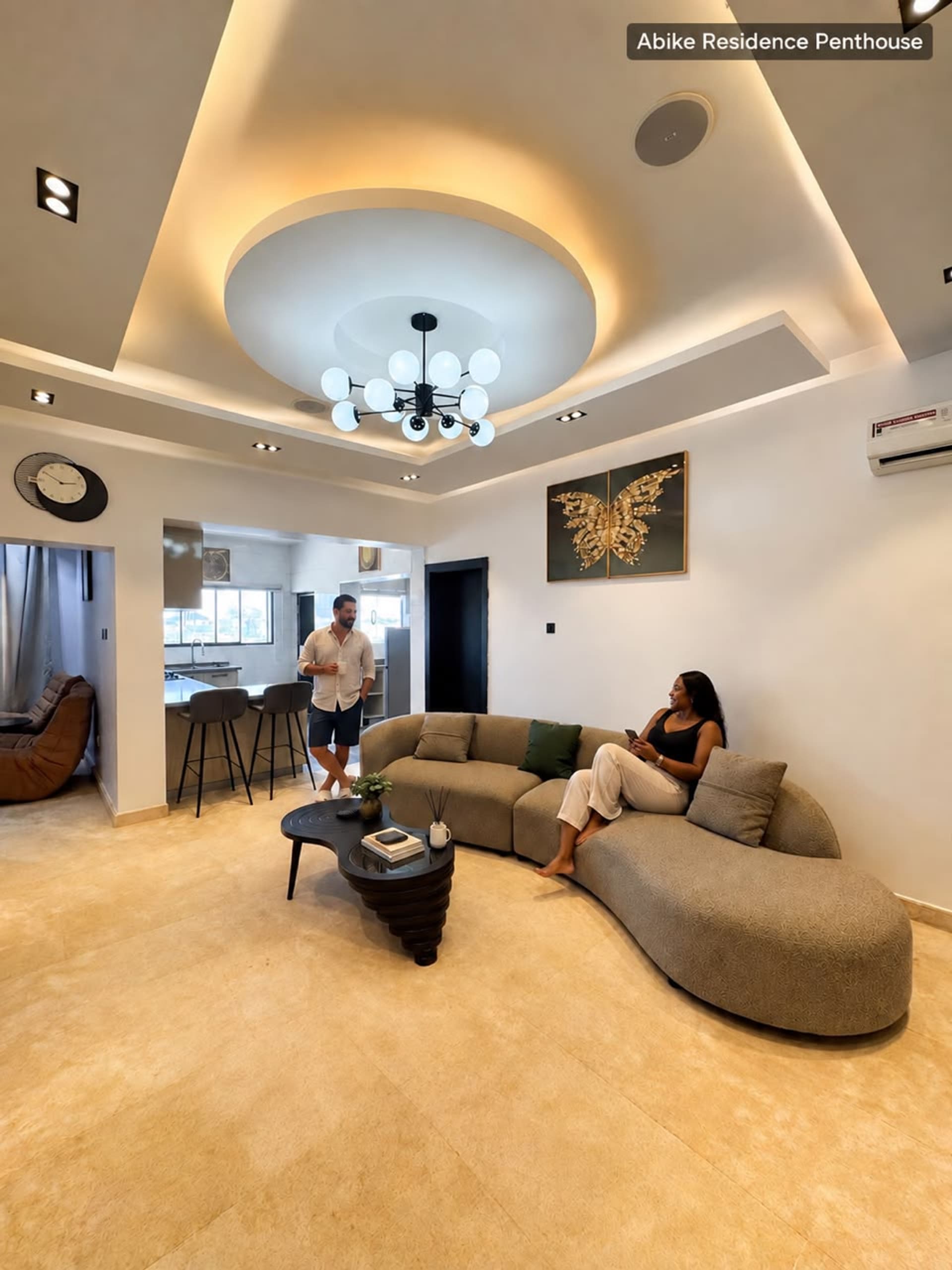 Guests chatting in a bright, sunlit lounge
