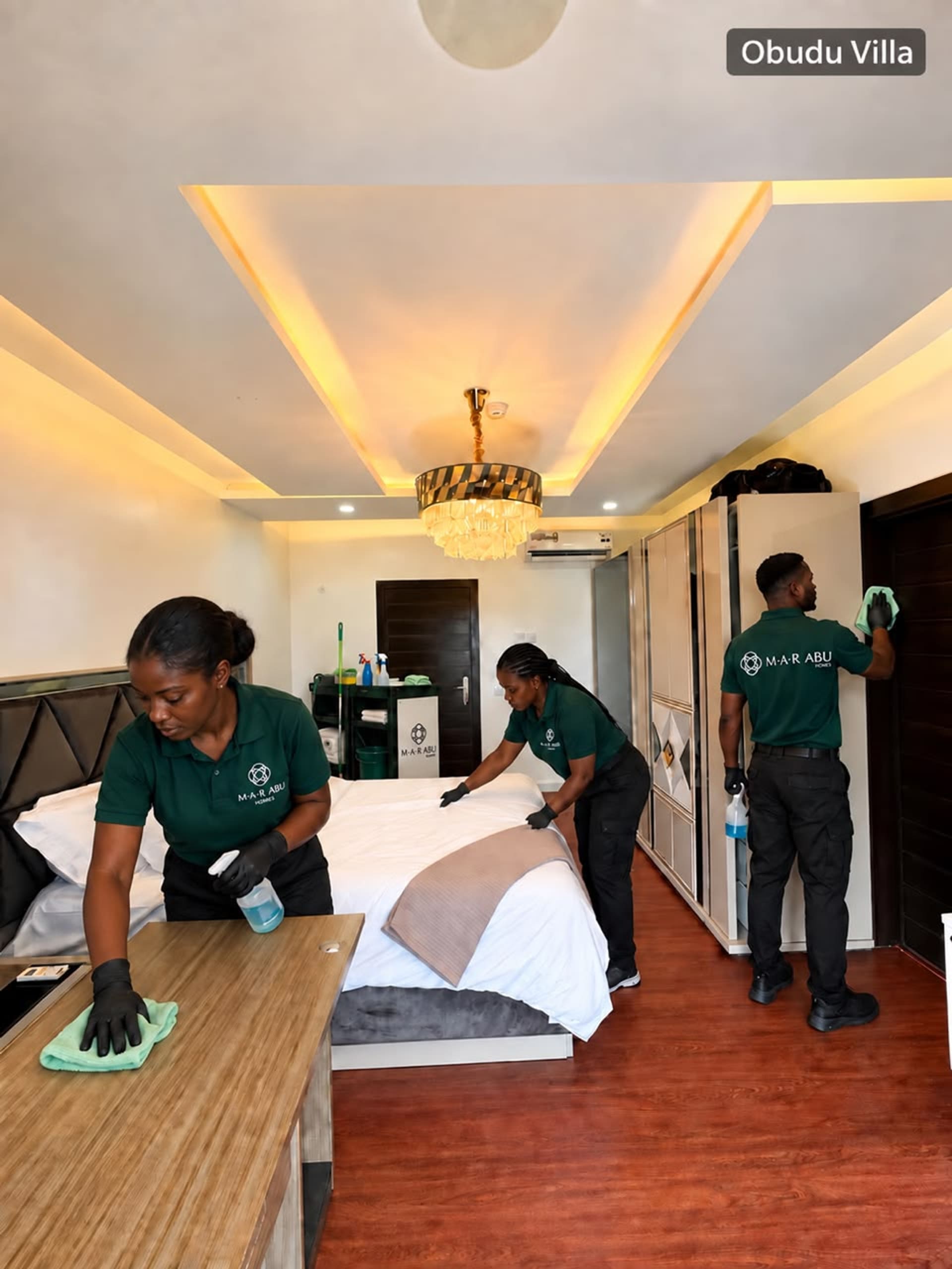 M.A.R Abu Homes housekeeping team preparing a bedroom